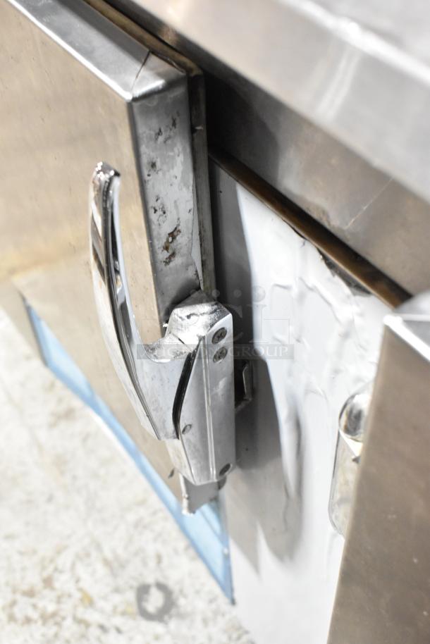 Leader LB84 Stainless Steel 3 Door Undercounter Cooler, showing some wear. 115 Volts, 1 Phase, commercial use.