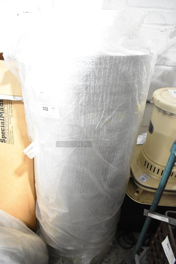 Insulated roll wrapped in plastic, alongside a wet floor sign. Visible label: "232 QTY." Auction includes multiple items.