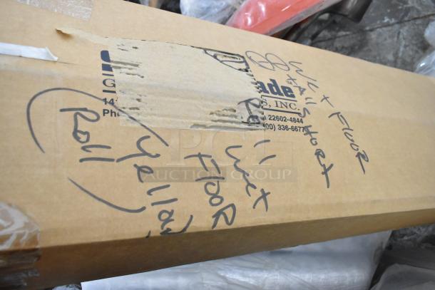 Box labeled with "wet floor" and "yellow roll"; contains insulated rolls and a wet floor sign. Good condition, taped.