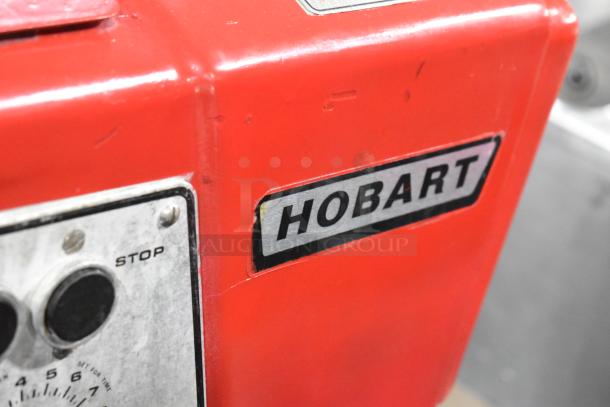 Hobart D-300T 30 Quart Planetary Dough Mixer, red, with mixing bowl and whisk. Features power controls and Hobart logo.