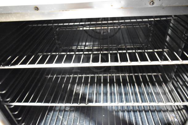 Blodgett stainless steel convection oven interior with metal racks, view-through doors, thermostatic controls.