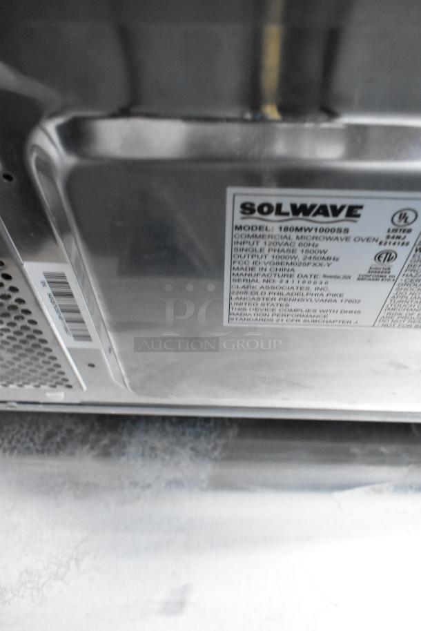 2024 Solwave 180MW1000SS stainless steel commercial microwave oven, 120V, 1 phase. Model and specs label visible.