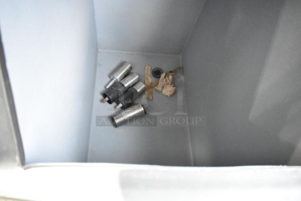 Manitowoc commercial ice bin interior with metal fittings and paper inside. Suitable for model IRT0620A-161.