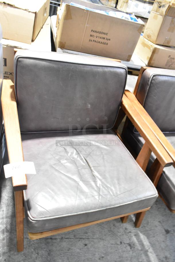 Wooden chair with gray cushion, visible wear on seat. Part of set including a two-person couch. Auction label marked "268".