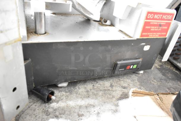 Bizerba metal commercial countertop meat slicer stacker, featuring control panel and "Do Not Hose" warning sign, in used condition.