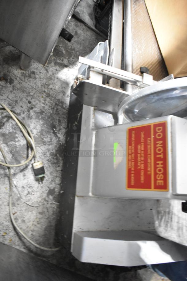 Bizerba metal commercial countertop meat slicer stacker with visible "DO NOT HOSE" warning label. Used condition.