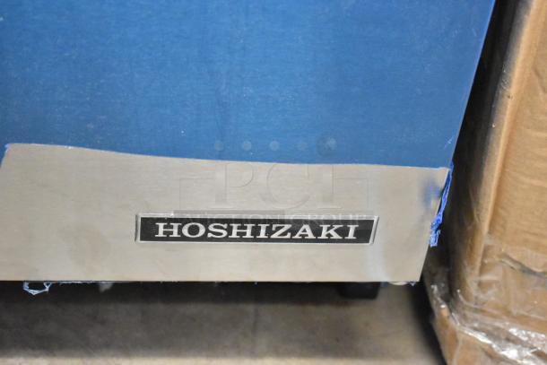 Brand new 2025 Hoshizaki AM-50BAK stainless steel ice machine, scratch and dent, with Hoshizaki label visible.