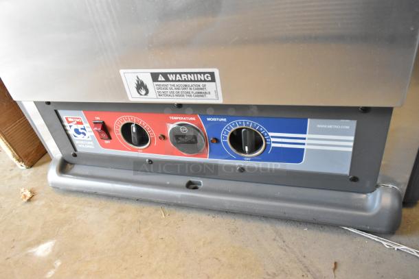 Metro WC5MM-251002-002 C5 heated holding cabinet, new scratch and dent. Features commercial casters, temp and moisture dials.