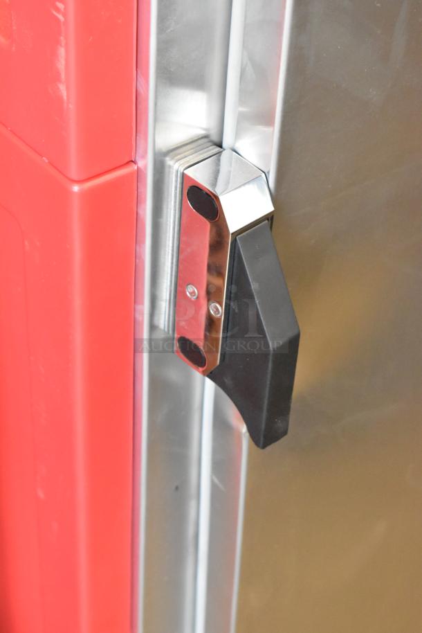 Brand new Metro WC5MM-251002-002 heated holding cabinet, red panel, sleek handle, slight dents visible.