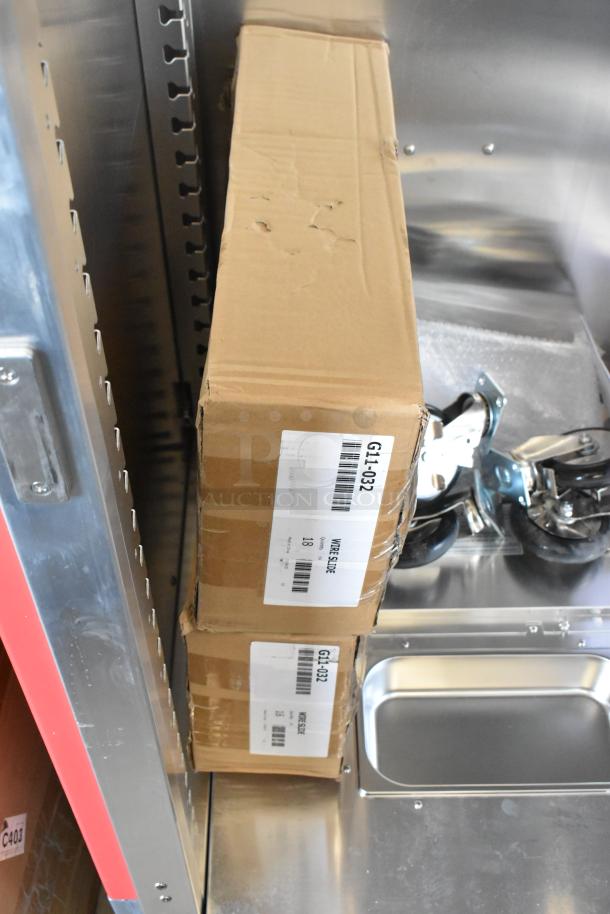 Brand new Metro WC5MM-251002-002 heated cabinet. Includes commercial casters. Visible tags indicate "WIRE SLIDE" and model info.