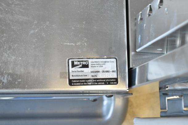 BRAND NEW SCRATCH AND DENT 2025 Metro WC5MM-251002-002 heated holding cabinet, serial label visible, with commercial casters.