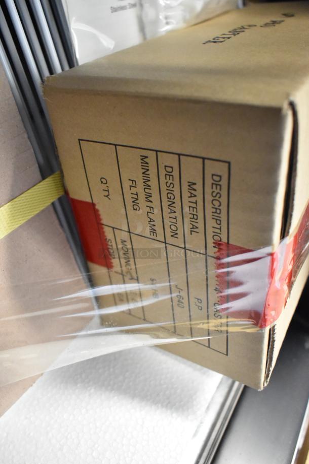 Cardboard box with label showing material designation as P.P. and J-640. Box corner secured with red and clear tape.