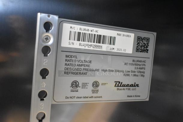 Label on Blue Air BLUR48-HC cooler showing model, voltage 115V, phase 1, and refrigerant R290. Made in Korea.