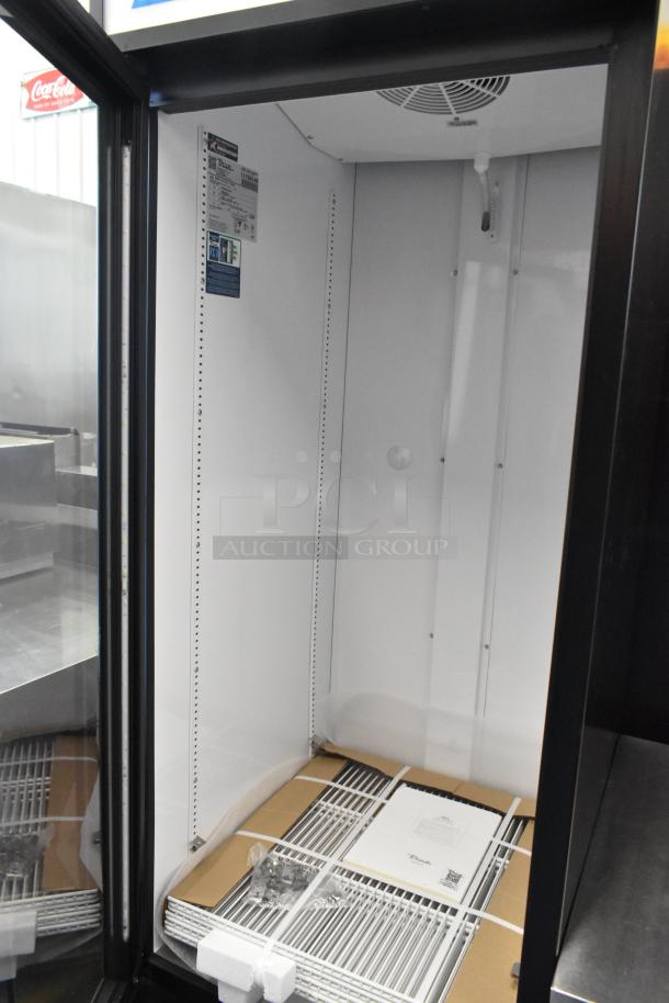 Brand new True GDM-23-HC metal cooler, single door, reach-in, poly coated racks, 115V, 1 phase, minor scratches.