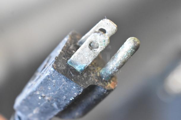 Corroded plug of Promax TMC-500 vacuum tumbler, commercial use, 110V, 1 phase, indicates wear.