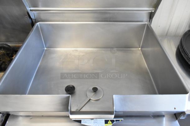 Cleveland stainless steel commercial braising pan, floor style, with a hinged lid, pristine condition, visible control panel.