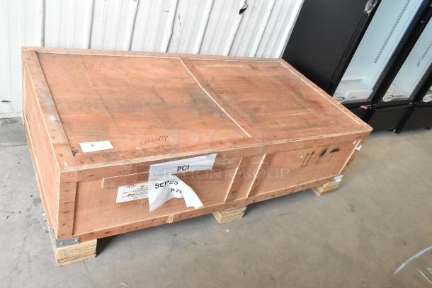 Wooden crate labeled PCI containing a new Avantco Chef Series CAG-60-TG 60" gas griddle. Sealed and secured for shipping.