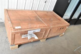 Wooden crate labeled PCI containing a new Avantco Chef Series CAG-60-TG 60" gas griddle. Sealed and secured for shipping.