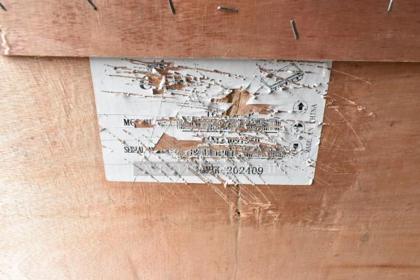 Scratched label on Avantco Chef Series CAG-60-TG 60" countertop gas griddle carton; shows model and serial number partly obscured.