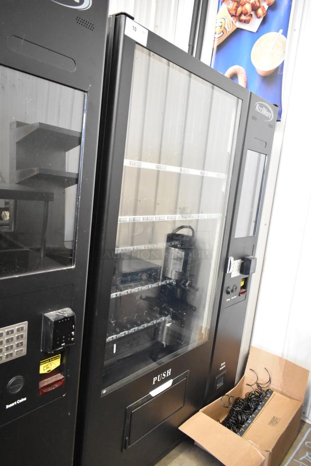 Brand new KoolMore metal vending machine, commercial grade, scratch and dent condition, multiple shelves, payment system.