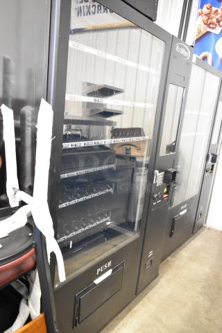 BRAND NEW SCRATCH AND DENT! KoolMore metal commercial vending machine with glass front and multiple rows for snacks.
