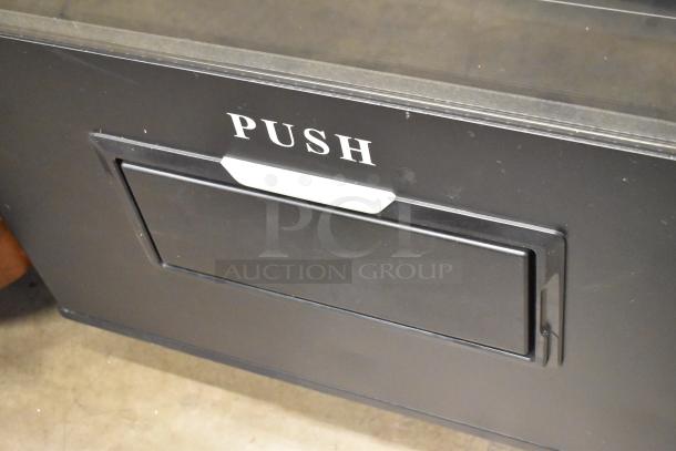 Brand new KoolMore metal vending machine, minor scratches. Features a "PUSH" labeled panel. Ideal for commercial use.