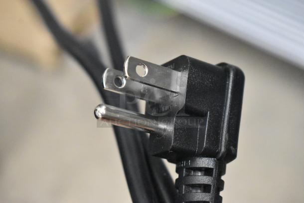 Close-up of a power cord plug for the KoolMore KM-MDR-1GD-10C cooler, showing standard three-prong configuration.