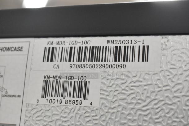 Barcode labels on KoolMore KM-MDR-1GD-10C commercial cooler, indicating brand and model specifics.