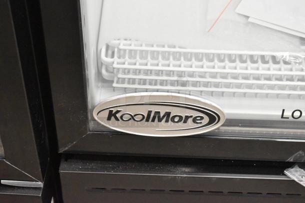 Brand new KoolMore KM-MDR-1GD-10C metal single door cooler with poly coated racks, on commercial casters.