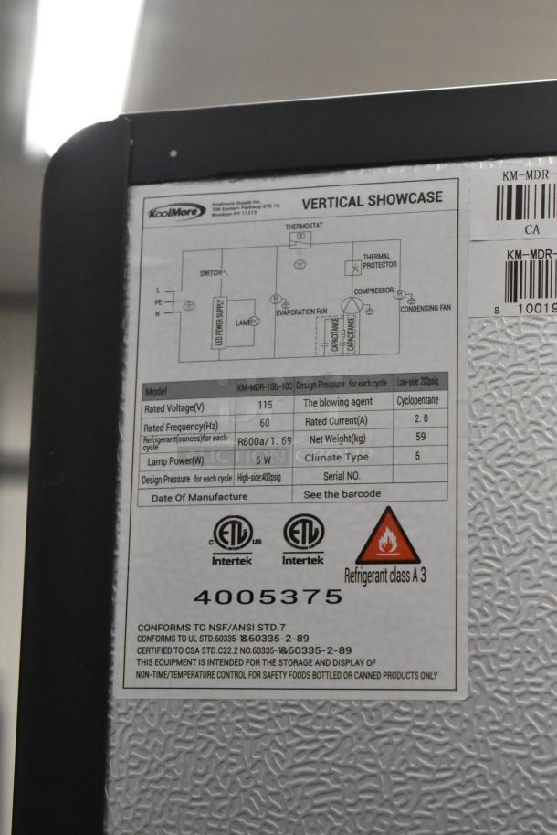 KoolMore KM-MDR-1GD-10C commercial cooler label, 115 Volts, 1 Phase, ETL certified, refrigerant class A3, on commercial casters.