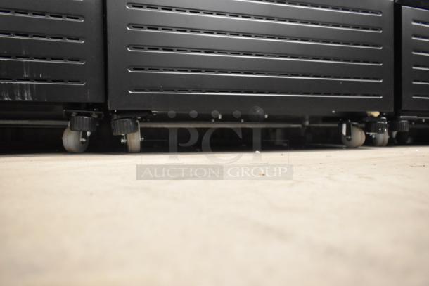 KoolMore KM-MDR-1GD-10C cooler on commercial casters, showing underside view. New condition, scratch and dent.