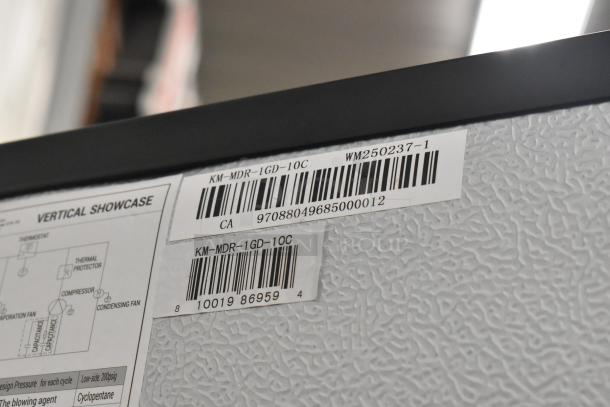 KoolMore KM-MDR-1GD-10C cooler label showing model number and barcodes, indicating commercial refrigerator details.
