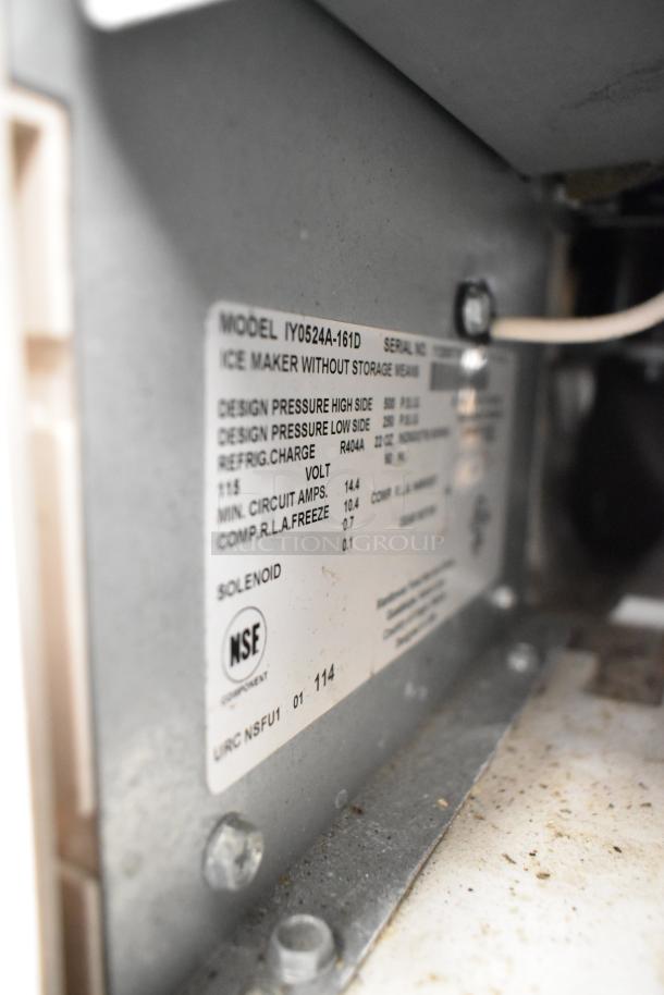 Manitowoc IY0524A-161D ice maker label showing specifications, including 115 volts, and NSF certification.
