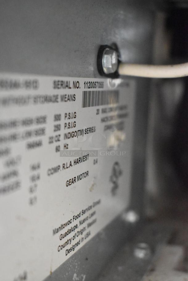 Stainless steel Manitowoc IY0524A-161D ice head on B420 bin, 115V, 1 phase. Label shows serial number and gear motor details.