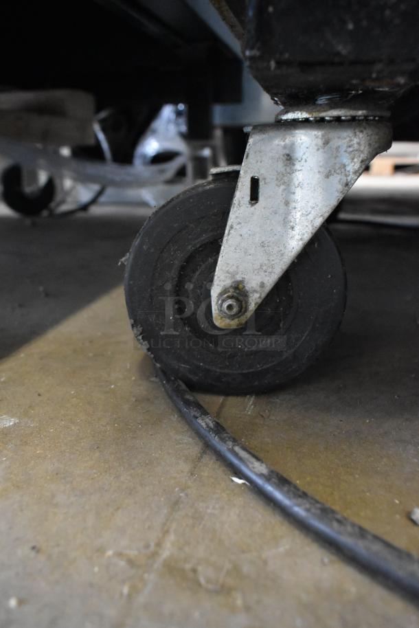 2018 True T-23F-HC freezer caster detail, showing sturdy commercial caster for easy mobility.