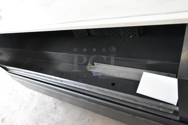 Structural Concepts SBZ6652DR metal merchandiser on casters, black interior, 220V, 1 phase, commercial use, visible shelf component.