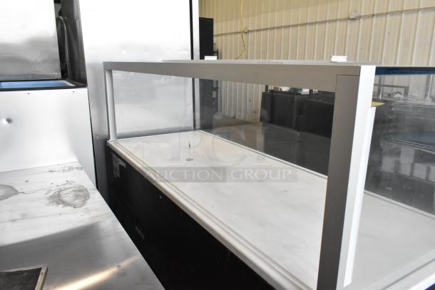 Structural Concepts SBZ6652DR metal grab-n-go merchandiser, glass front, commercial casters, 220V, 1 phase, good condition.