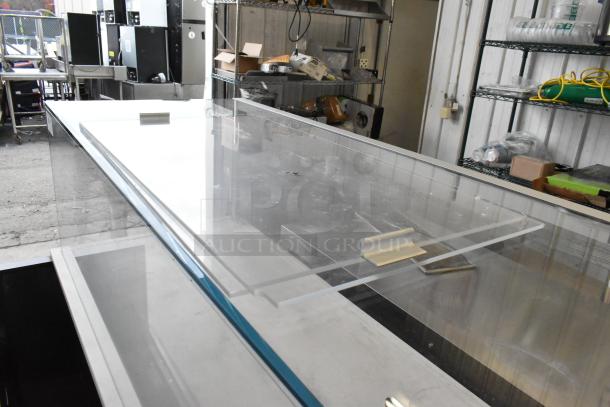 Structural Concepts SBZ6652DR metal commercial grab-and-go merchandiser on casters, 220V, 1 phase, horizontal design.