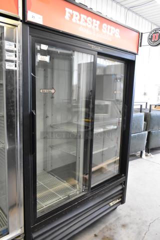 True GDM-45 metal 2-door reach-in cooler merchandiser with poly-coated racks, commercial casters, and branding label visible.
