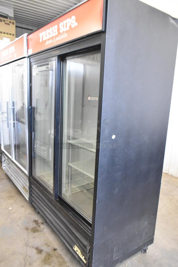 True GDM-45 commercial cooler with two glass doors, poly-coated racks, on casters. 115 volts, 1 phase. Good condition.