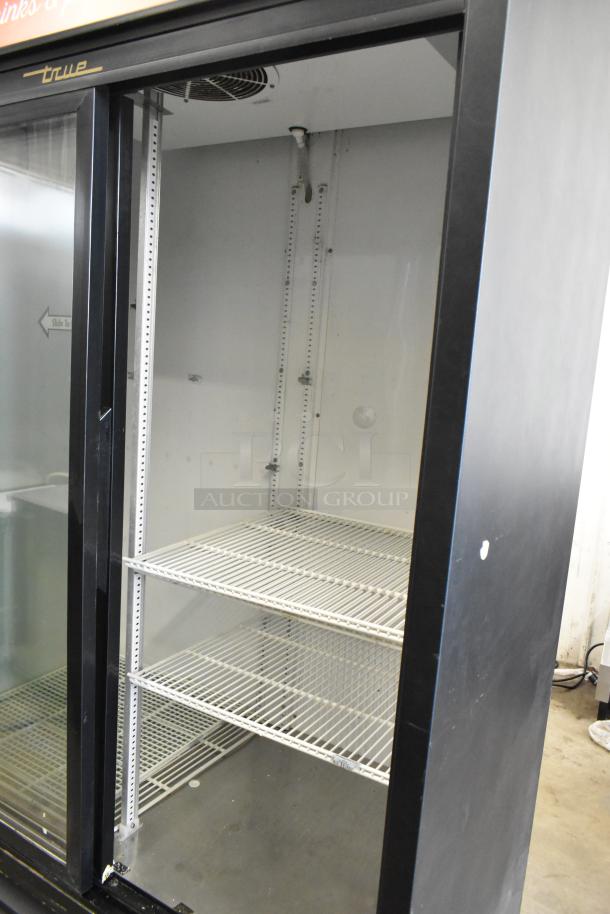 True GDM-45 metal commercial 2 door reach-in cooler with poly coated racks, on casters, 115 volts, 1 phase.