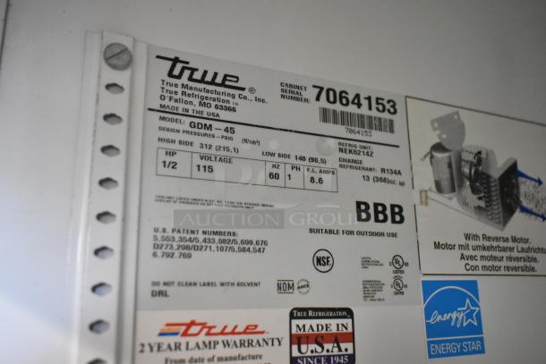 True GDM-45 cooler label with specs: 115 volts, 1 phase, 1/2 HP, NSF certified, Made in USA, poly coated racks.
