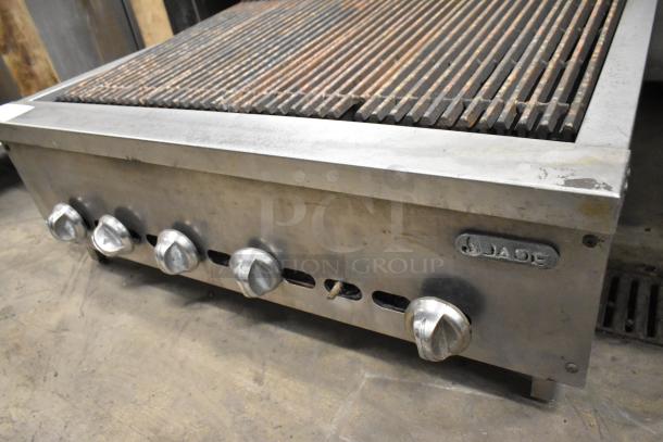 Jade Stainless Steel Gas Charbroiler Grill, commercial countertop model, four control knobs, used condition, brand logo visible.