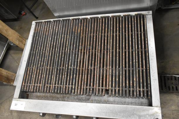 Jade Stainless Steel Commercial Charbroiler Grill, gas-powered, countertop model, used condition with visible wear on grates.