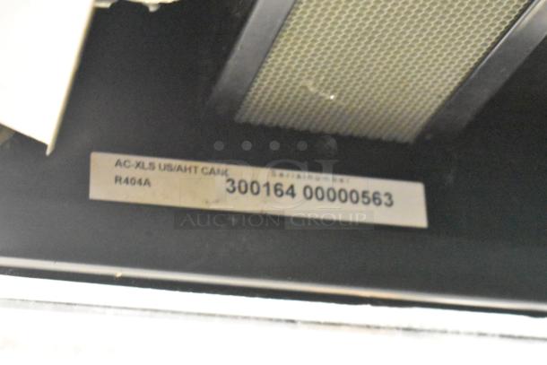 AC-XLS Metal Commercial Grab N Go Merchandiser; model and serial number visible, includes metal shelves, R404A refrigerant.