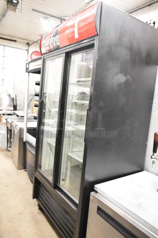True GDM-33 Metal Commercial 2 Door Reach In Cooler Merchandiser w/ Poly Coated Racks on Commercial Casters. 115 Volts, 1 Phase. - Item #1219188