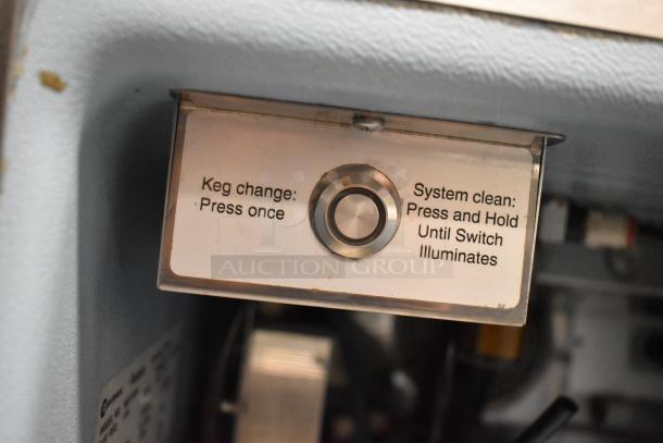 Close-up of control panel on a 2018 Delfield ND21RS00 single door nitrogen beverage dispenser, showing keg change and system clean instructions.