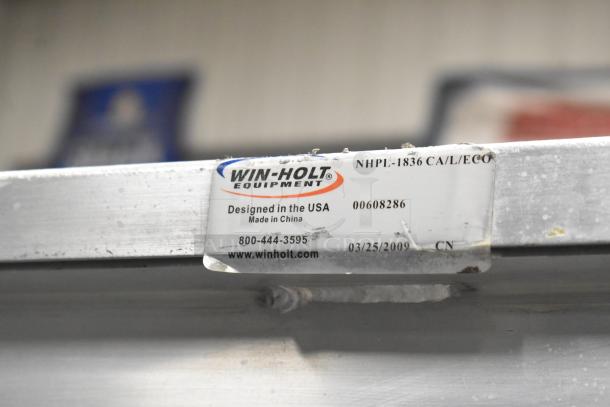 Win-holt commercial heated holding cabinet on casters, metal, 120V, 1 phase; label shows model NHPL-1836, designed in USA.
