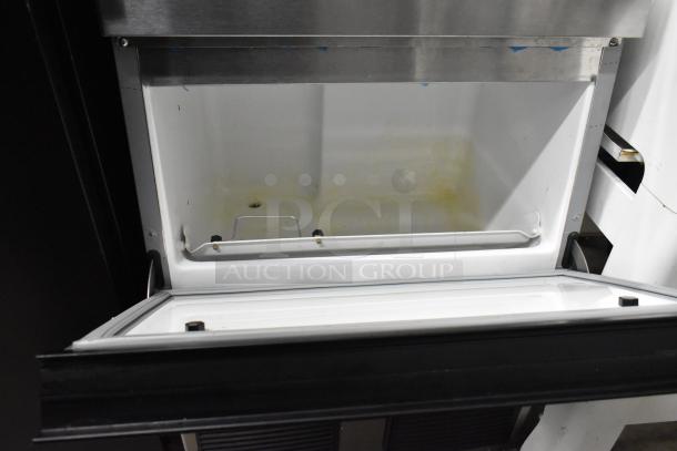 Hoshizaki F-330BAH-C stainless steel undercounter ice machine, open compartment view, minor interior discoloration.