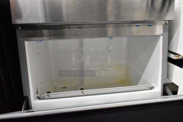 Hoshizaki F-330BAH-C stainless steel undercounter ice machine, interior view. 115 volts, 1 phase, some wear visible.